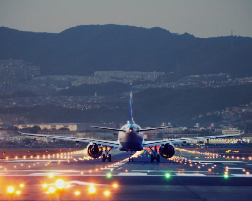 big plane landing at dusk at Osaka-Itami International Airport, Japan